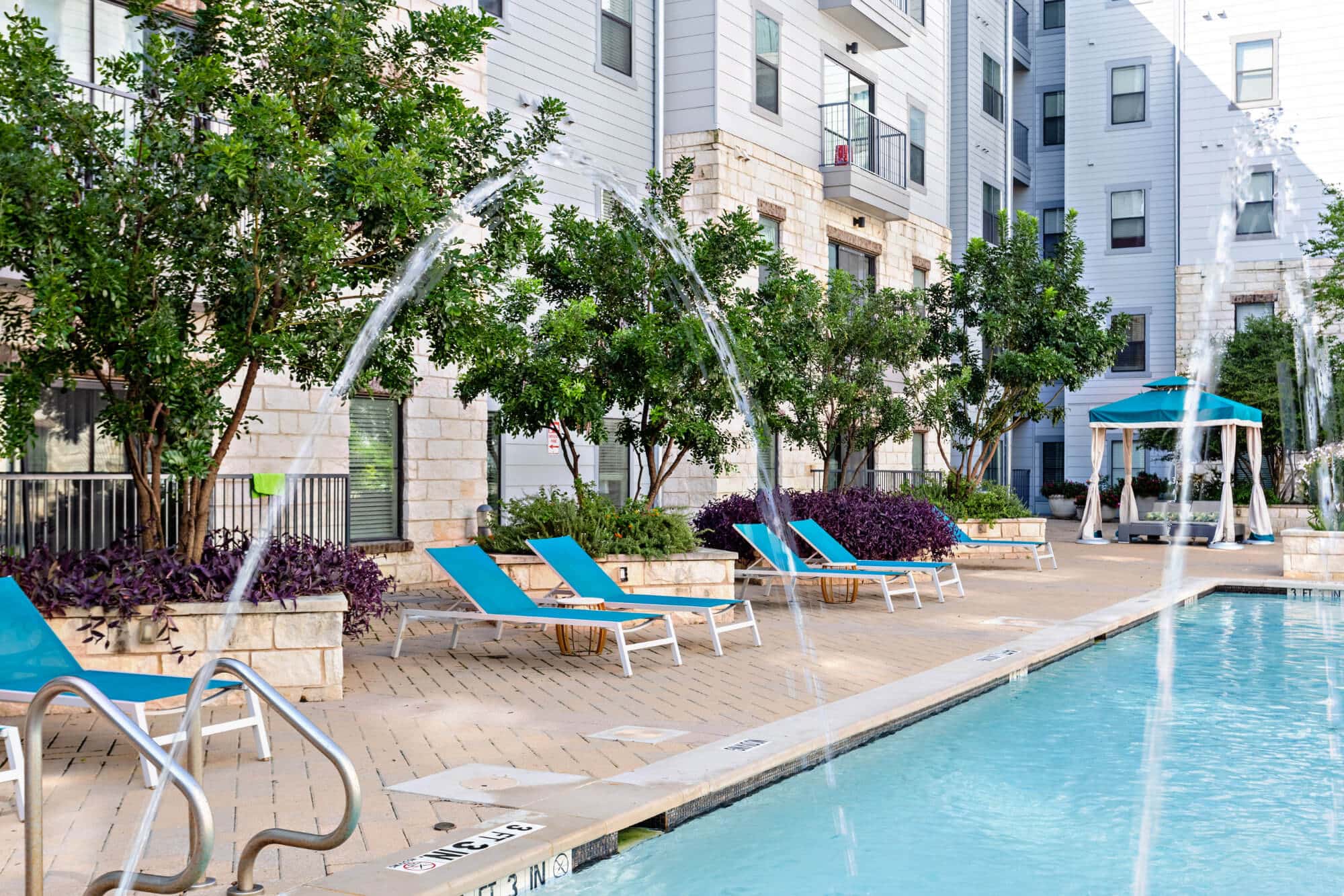 axis west campus off campus apartments in west campus near ut austin resort style pool cabanas and lounge seating